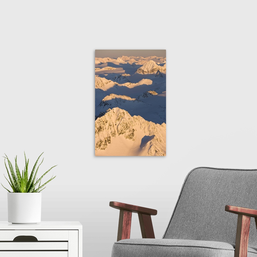 A modern room featuring Peaks Of A Snow Covered Mountain Range Glowing Pink At Sunset, Kachemak Bay State Park; Alaska, U...