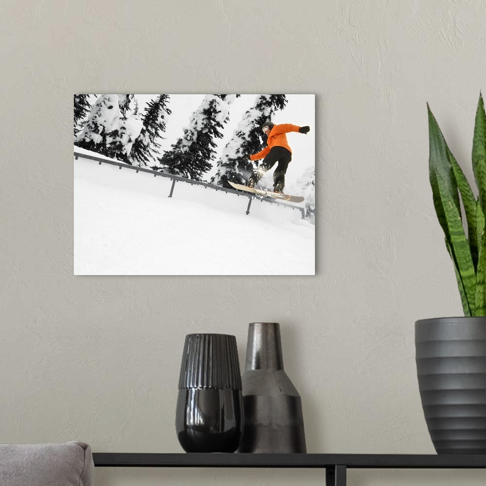 A modern room featuring Person Snowboarding On A Railing