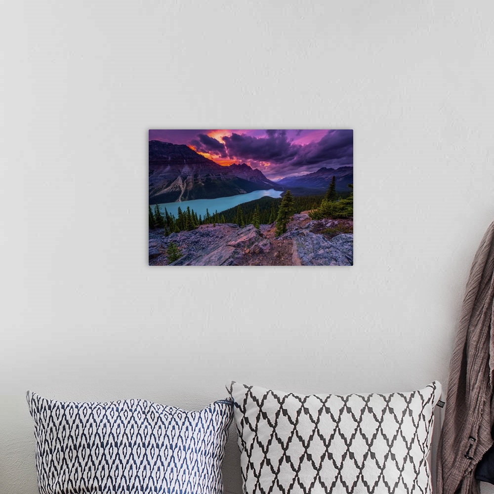 A bohemian room featuring Peyto Lake under dramatic skies, Banff National Park; Alberta, Canada