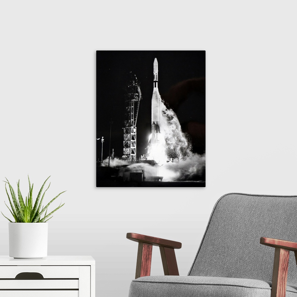 A modern room featuring Photograph taken during the launch an Orbiting Geophysical Observatory spacecraft. Dated 20th cen...