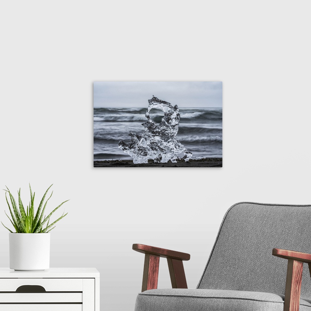 A modern room featuring Piece of ice on diamond beach, near Jokusarlon, with the ocean behind it along the south coast of...