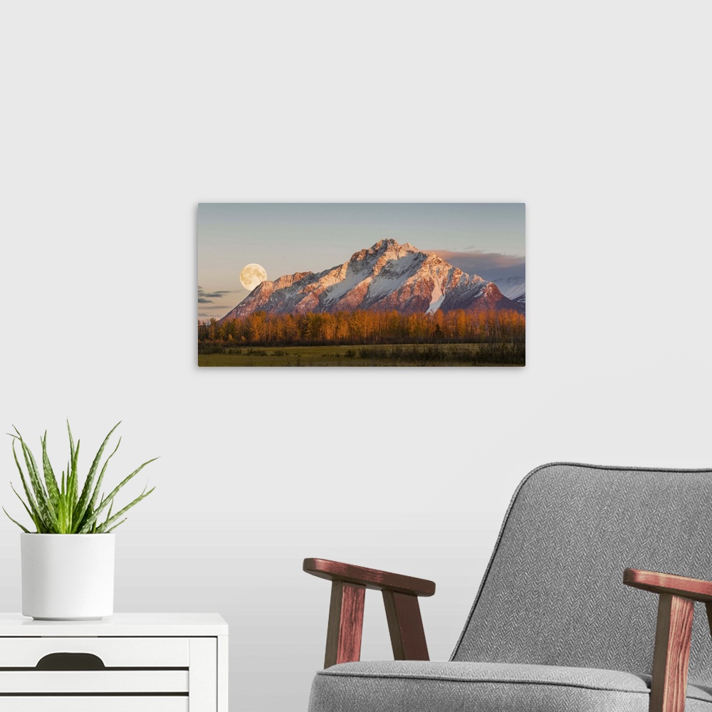 A modern room featuring Scenic sunset view of Pioneer Peak with the full moon rising over the Palmer Hay Flats, Alaska, A...