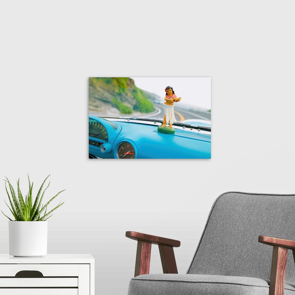 A modern room featuring Plastic Hula Doll On The Dashboard Of A Turquoise Thunderbird