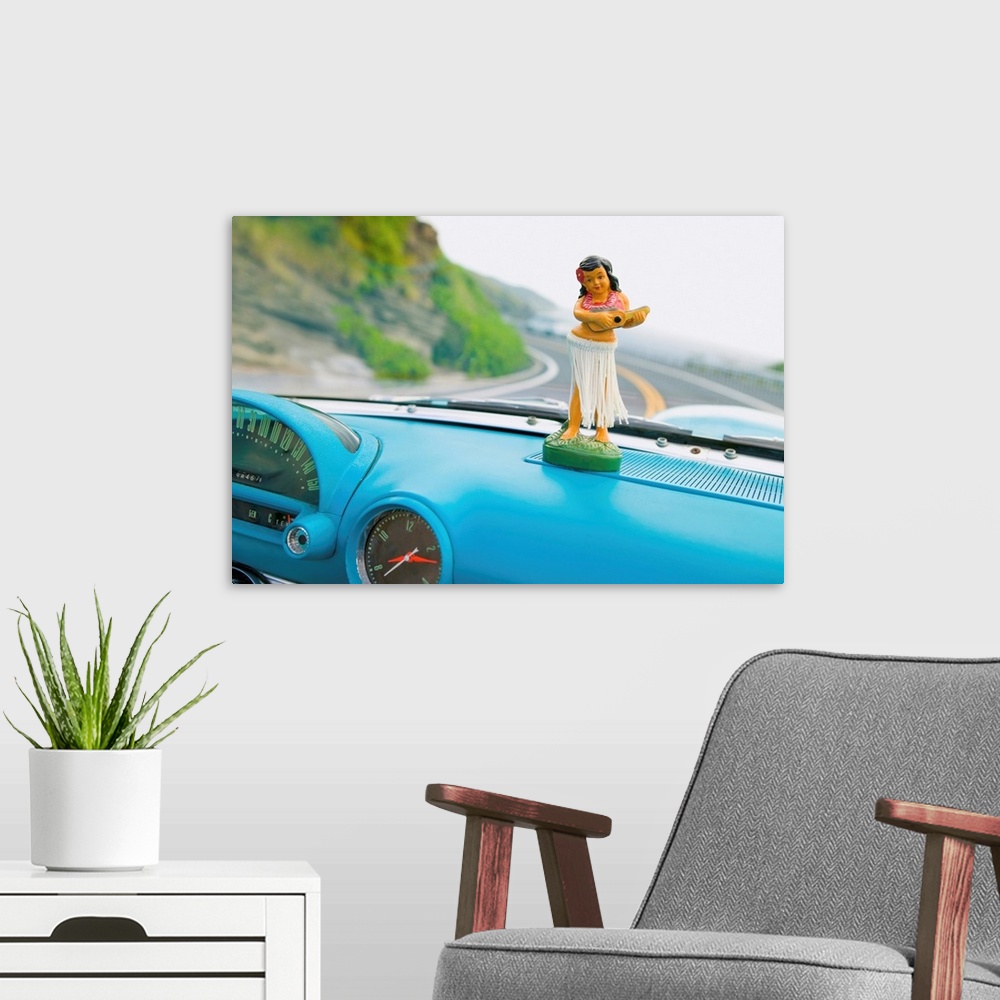 A modern room featuring Plastic Hula Doll On The Dashboard Of A Turquoise Thunderbird