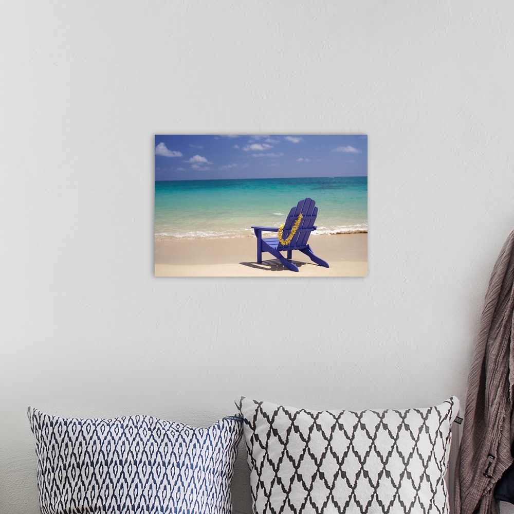 A bohemian room featuring Plumeria Lei Hanging Over Blue Beach Chair Along Shoreline