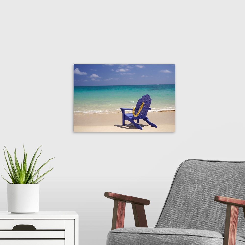 A modern room featuring Plumeria Lei Hanging Over Blue Beach Chair Along Shoreline
