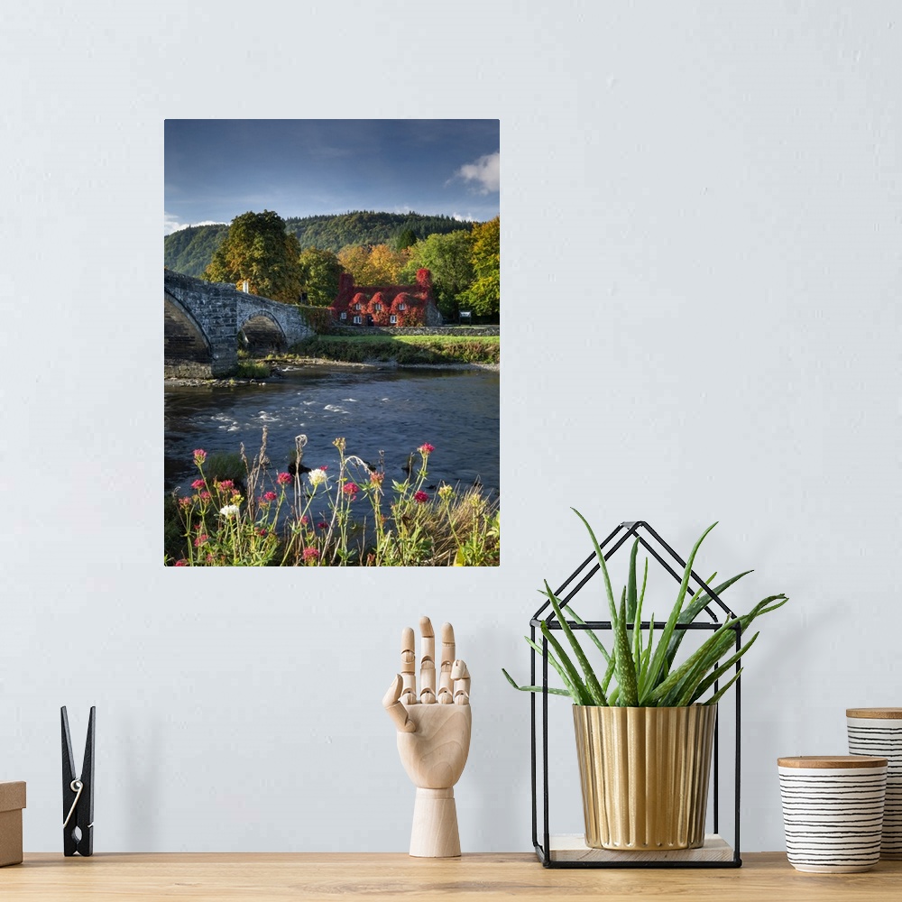 A bohemian room featuring Pont Fawr with Tu Hwnt I'r Bont and the River Conwy at Llanrwst in Snowdonia.