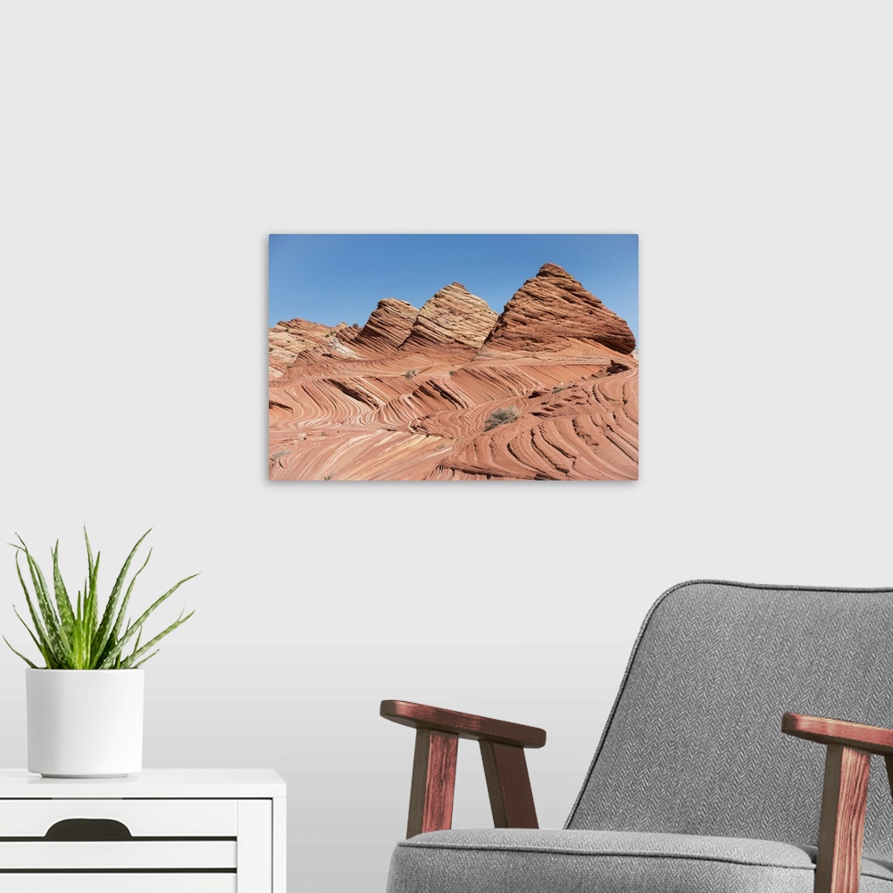 A modern room featuring Pyramid shaped sandstone rock formations at Coyote Buttes North, part of the Paria Canyon-Vermili...