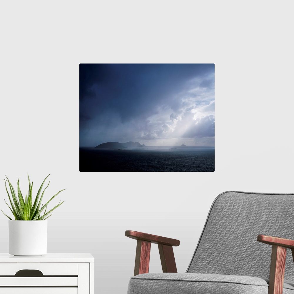 A modern room featuring Rainclouds over Blasket islands, co Kerry, Ireland.