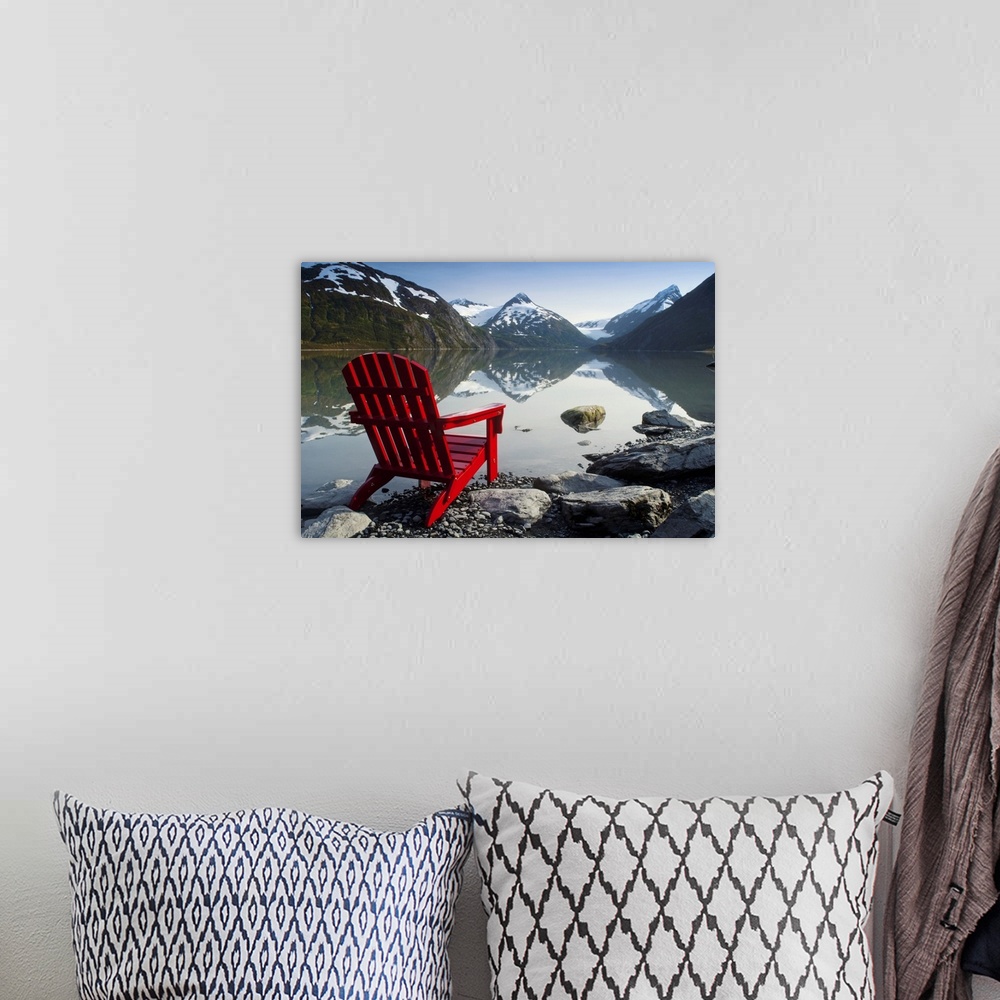 A bohemian room featuring Red Adirondack Chair At Portage Lake With Chugach Mountains In The Background, Southcentral, Alaska