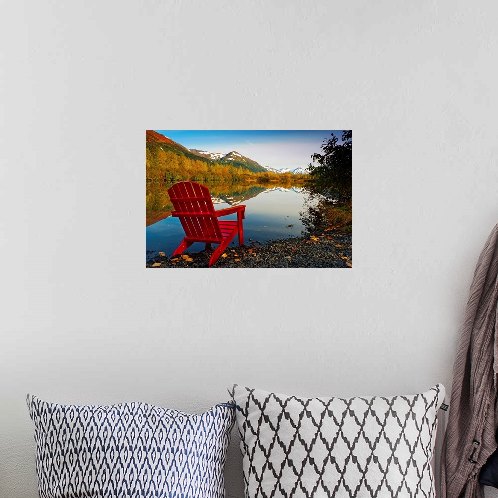 A bohemian room featuring Landscape photograph on a big canvas of a red Adirondack chair sitting at the edge of a lake that...