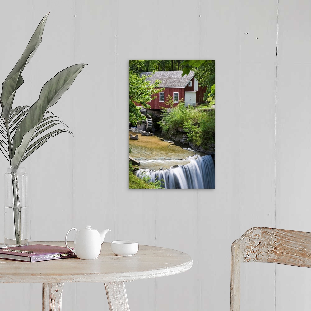 A farmhouse room featuring Red Barn With A Mill Wheel And Waterfall; Thorold, Ontario, Canada