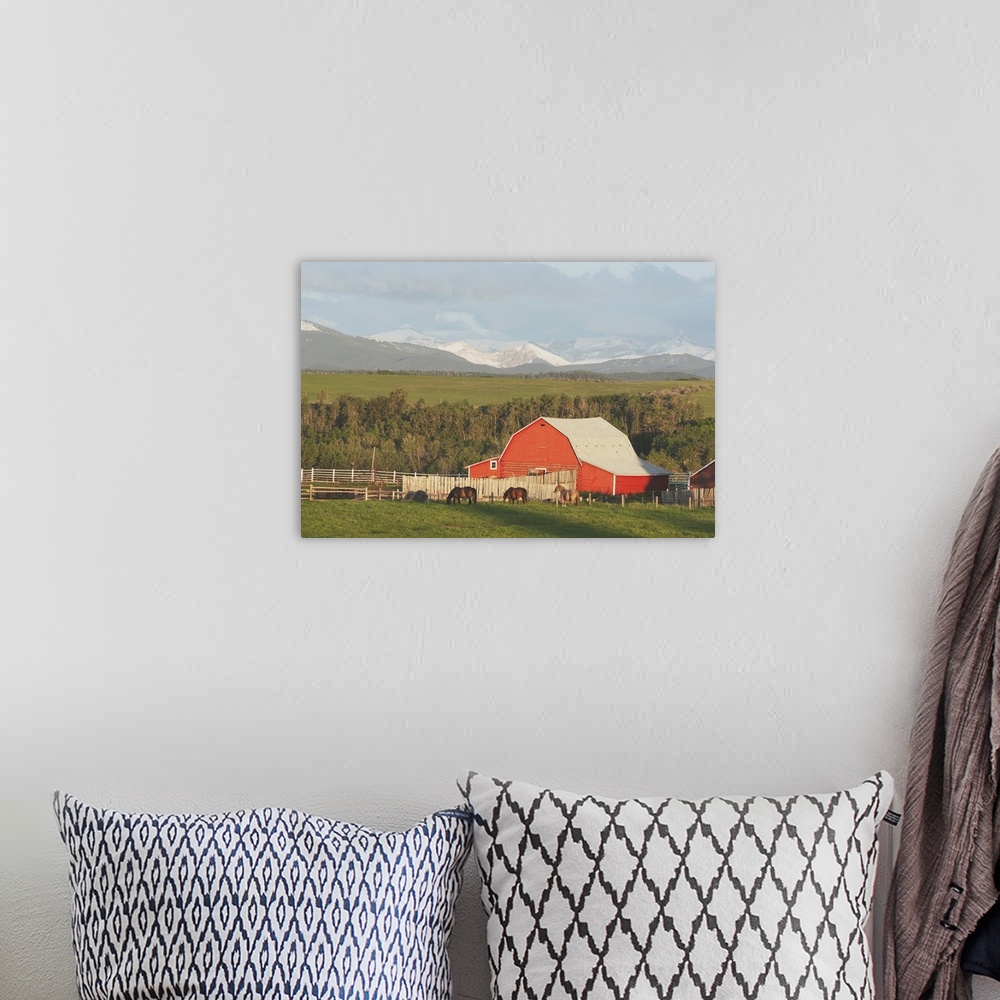 A bohemian room featuring Red Barn With Horses Grazing
