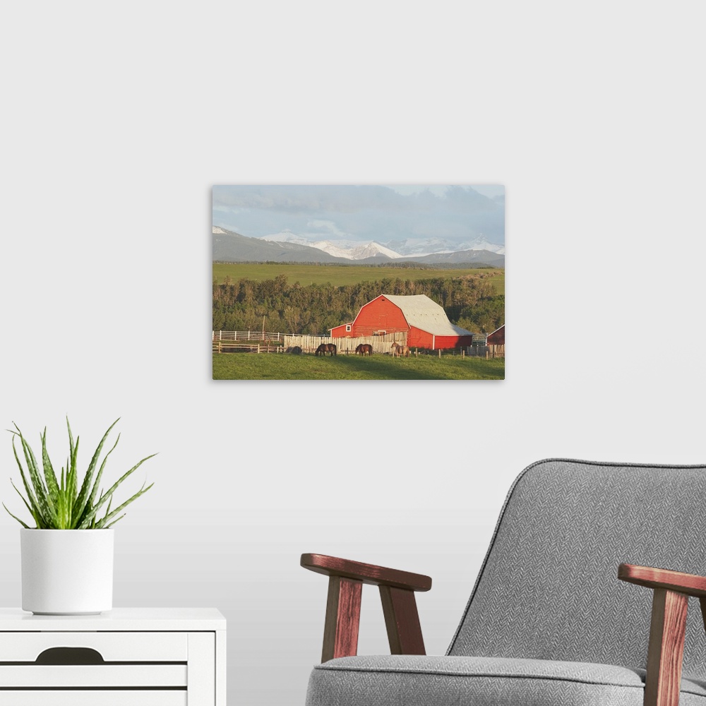 A modern room featuring Red Barn With Horses Grazing