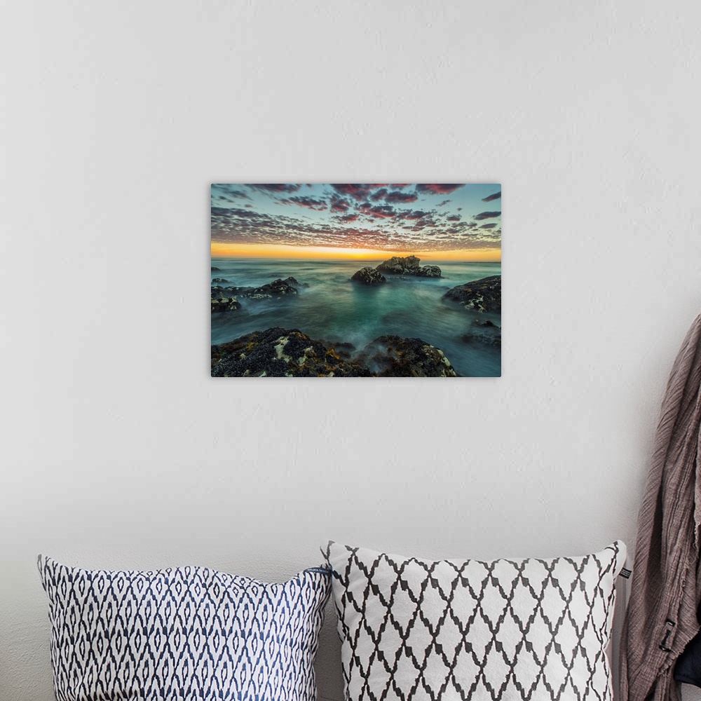 A bohemian room featuring Red clouds of sunset over the ocean along the coast of South Africa near Hondeklip Bay. Namakwa, ...