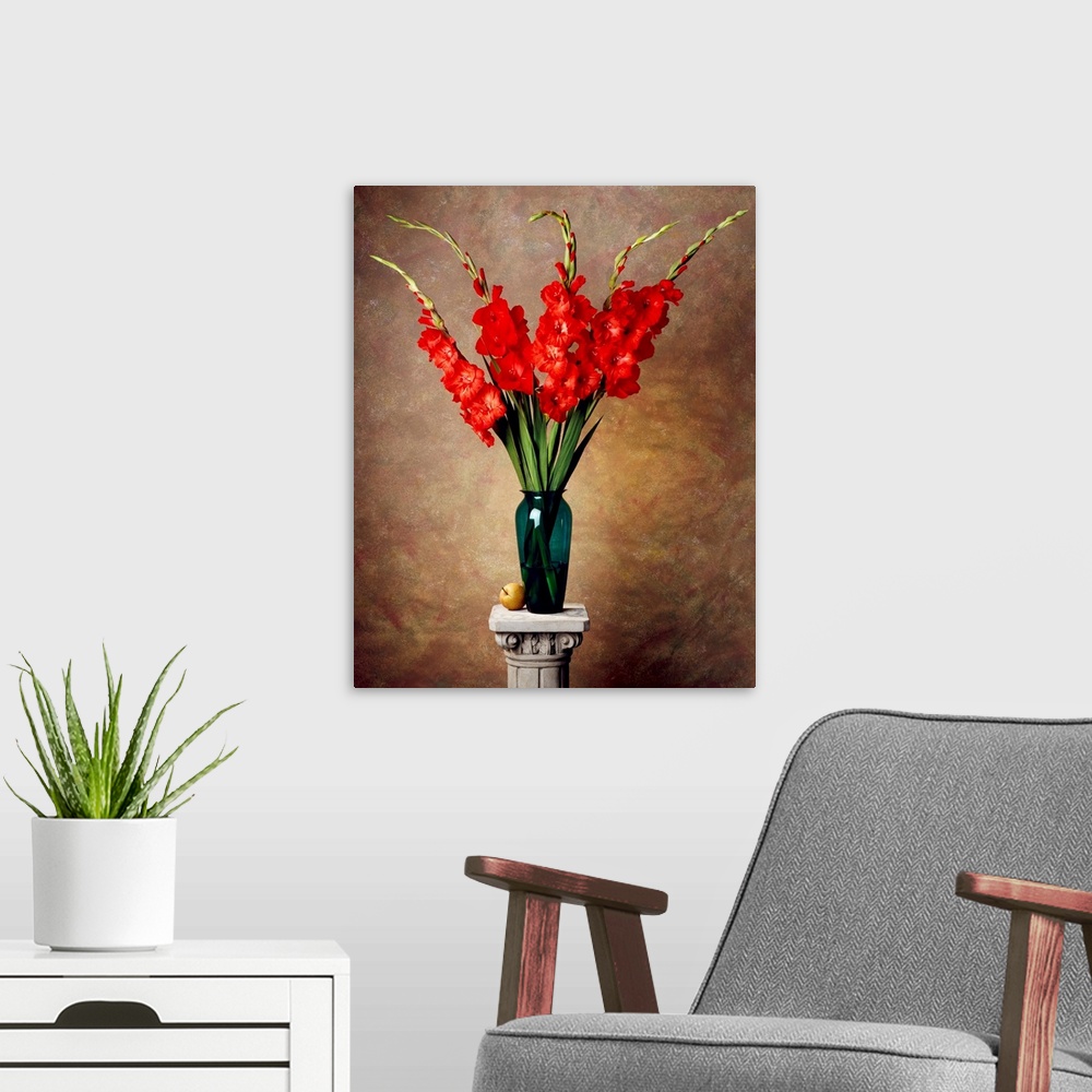 A modern room featuring Red gladiolas in a vase on a pedestal