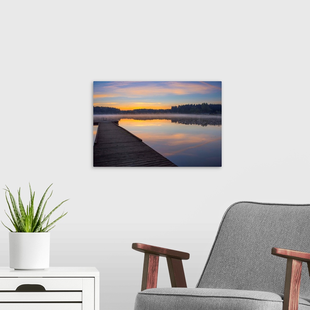 A modern room featuring Reflection of a beautiful serene sunrise on peaceful Scott lake, Washington, United States of Ame...