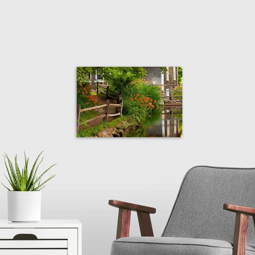 A modern room featuring Reflections in stream and flowers in bloom at Stony Brook Grist Mill.