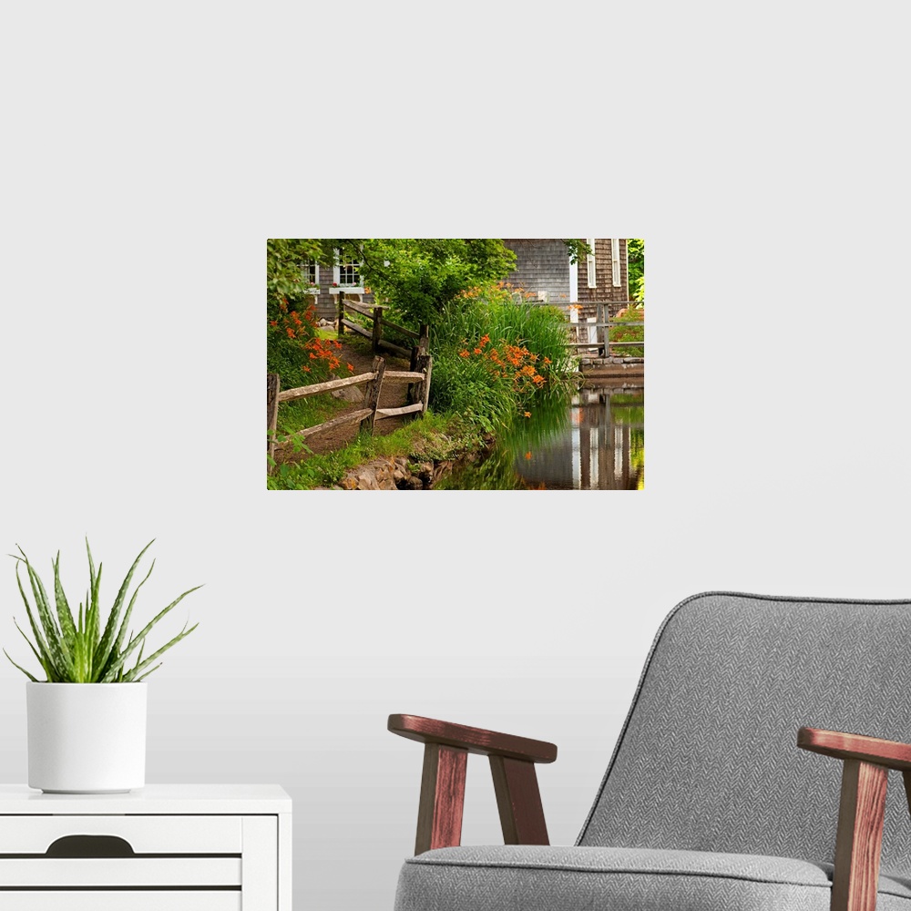A modern room featuring Reflections in stream and flowers in bloom at Stony Brook Grist Mill.