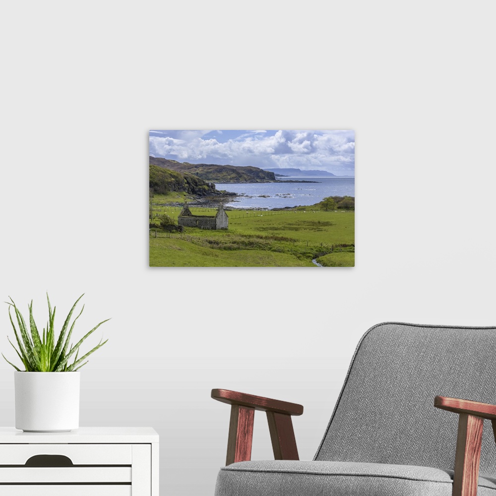 A modern room featuring Remains of a stone house in grassy field along the coast on the Isle of Skye in Scotland, United ...