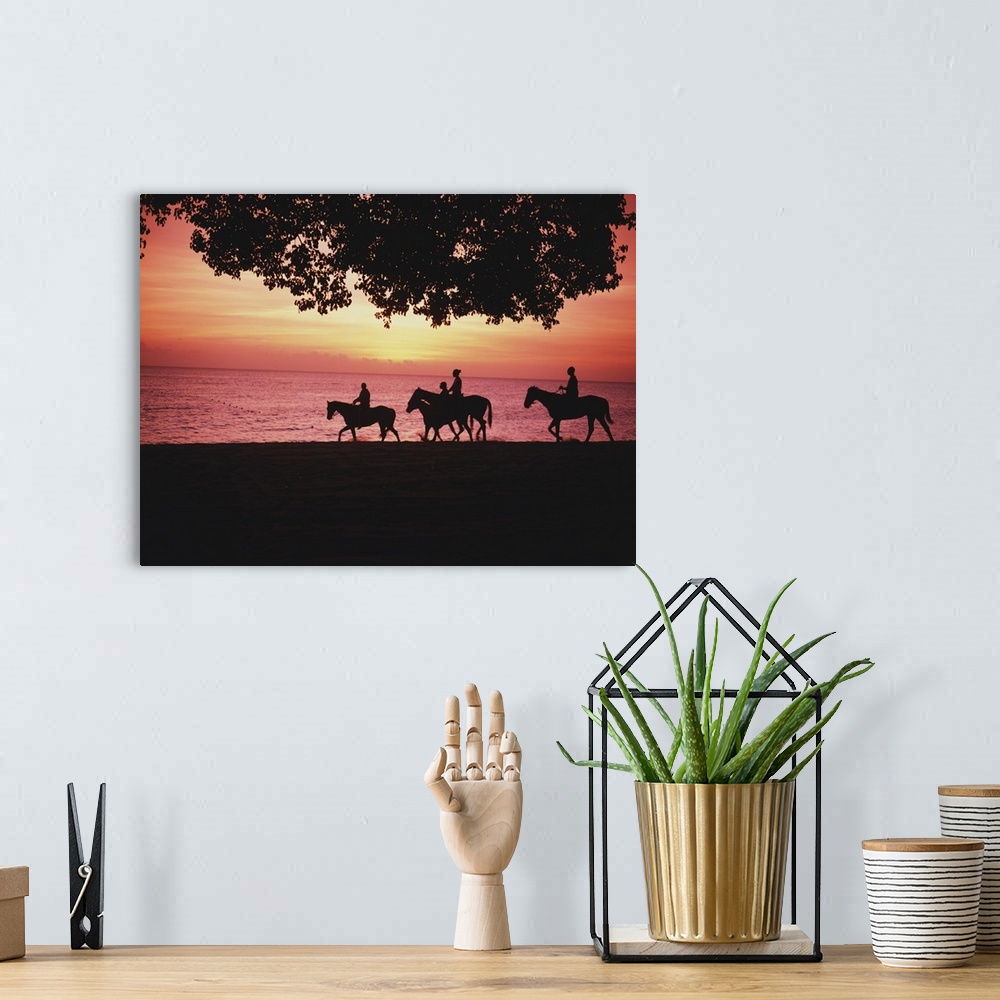 A bohemian room featuring Riding Horses On The Beach At Sunset
