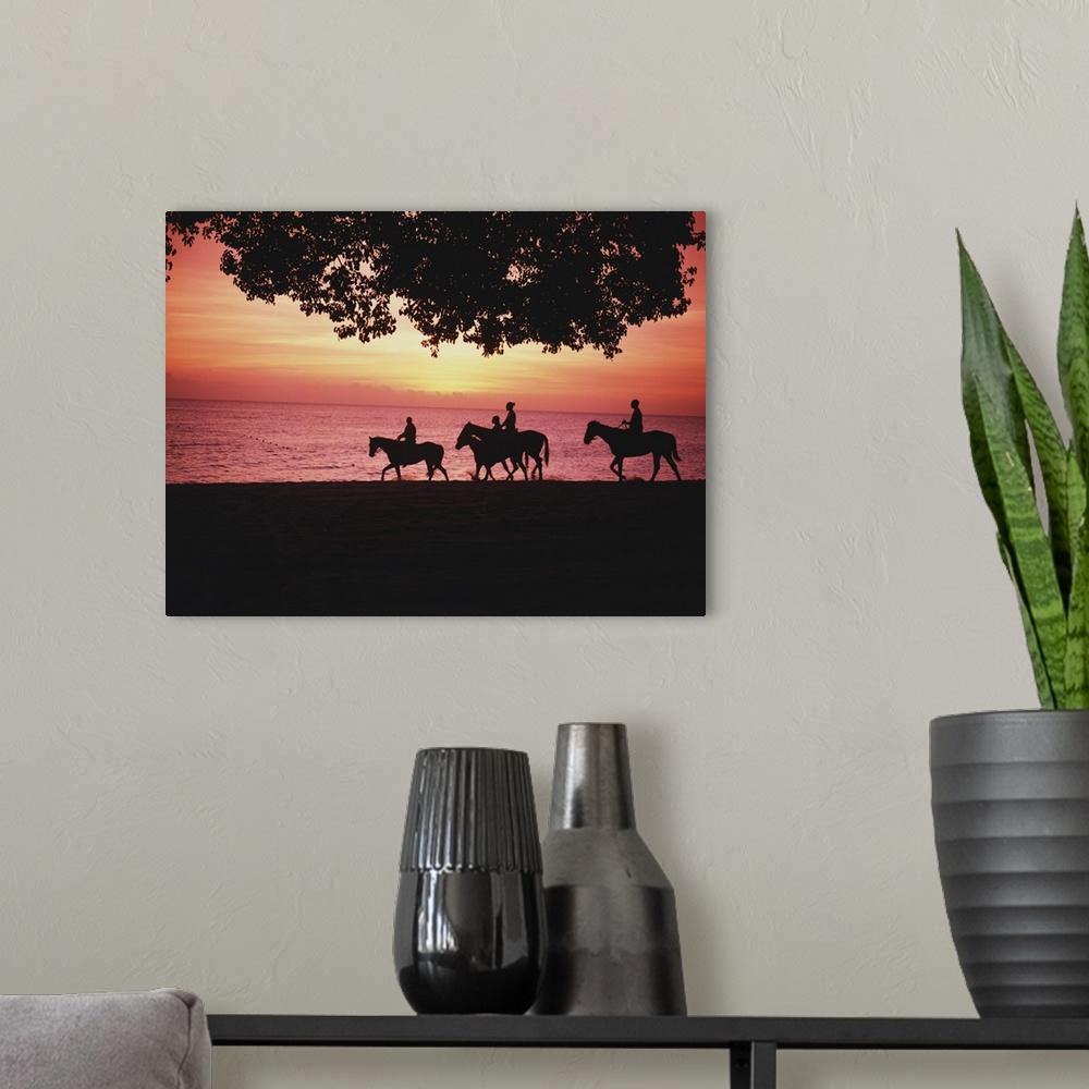 A modern room featuring Riding Horses On The Beach At Sunset
