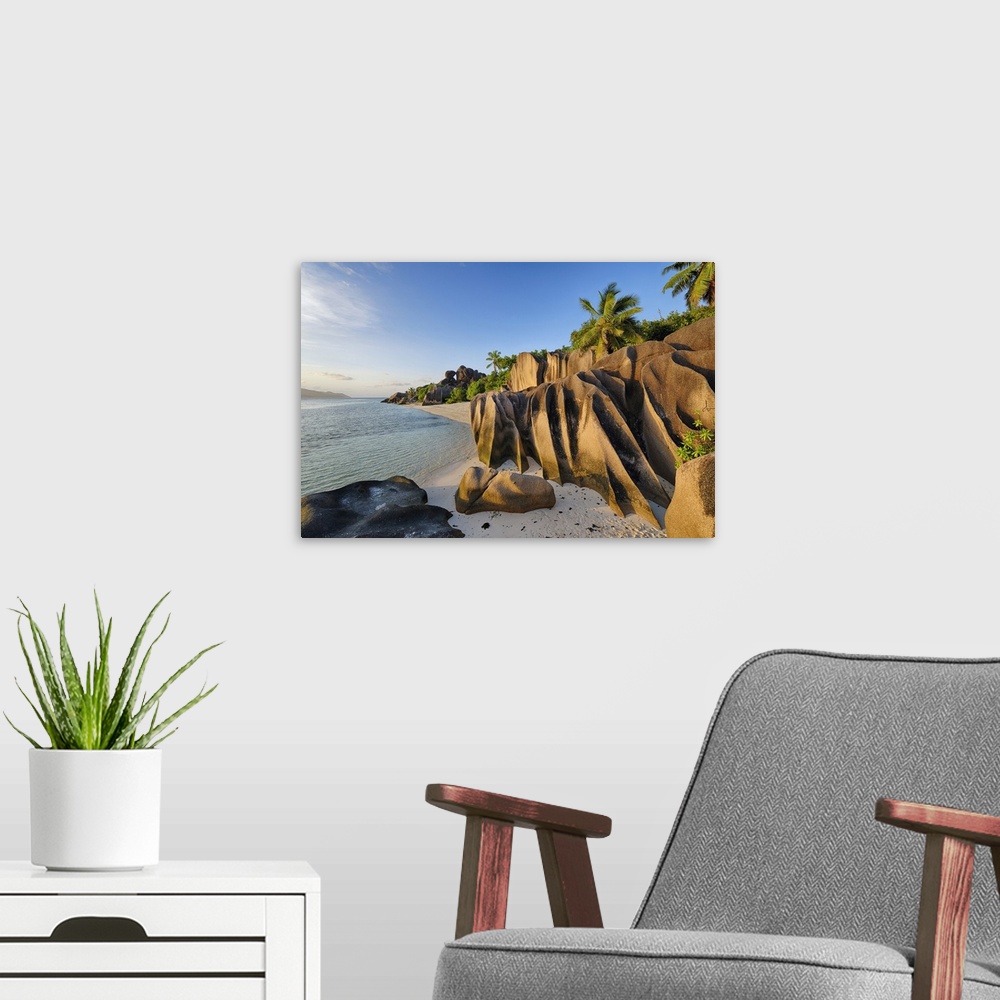 A modern room featuring Rock Formations and Palm Trees near Sunset, Anse Source doArgent, La Digue, Seychelles