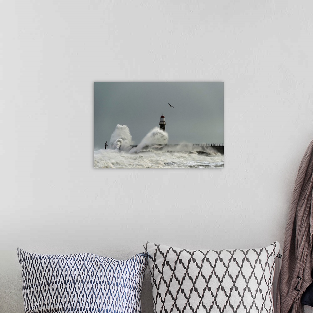 A bohemian room featuring Roker lighthouse and waves from the river ware crashing onto the pier. Sunderland, Tyne and Wear,...