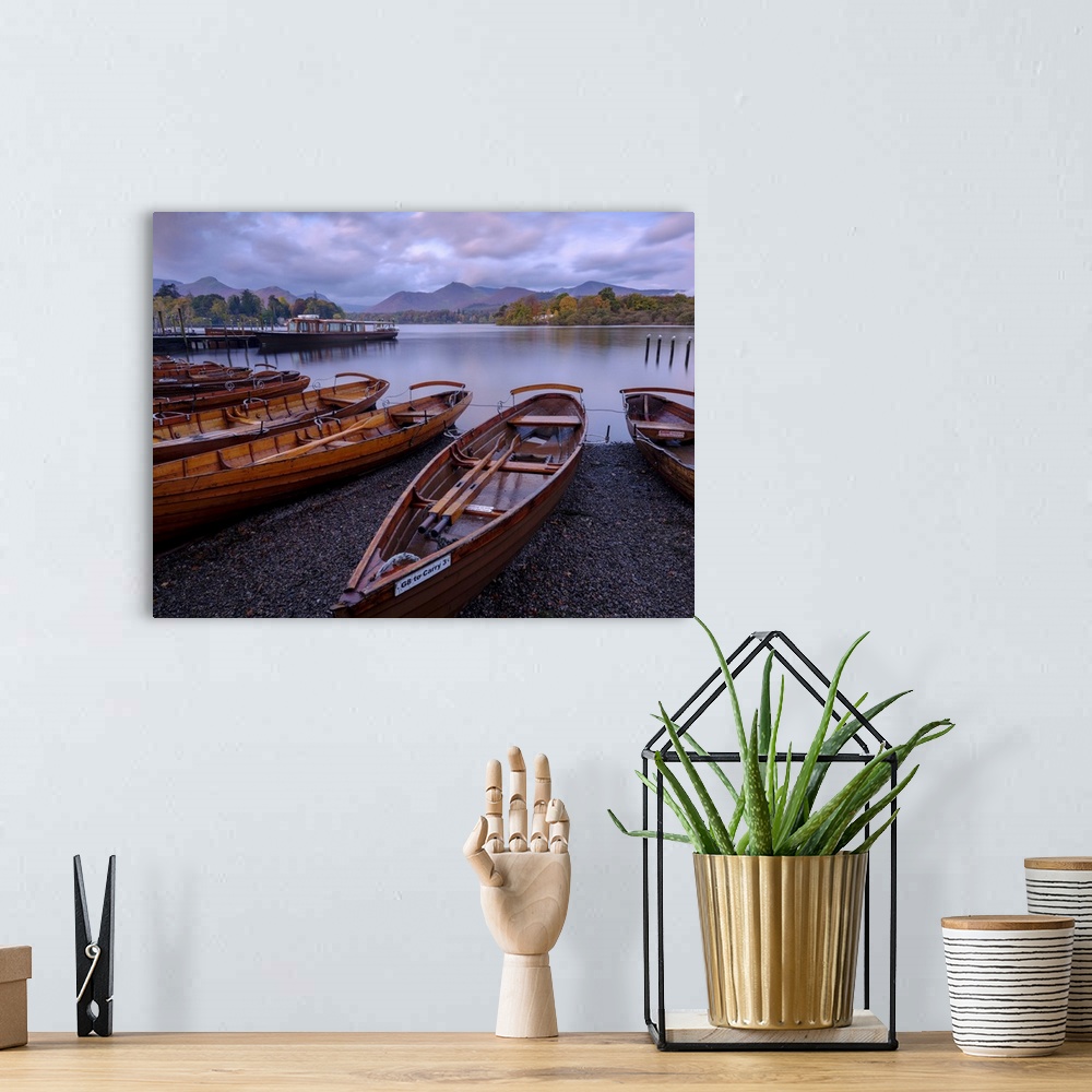 A bohemian room featuring Rowing boats on the shore of Derwent Water at Keswick in the English Lake District.