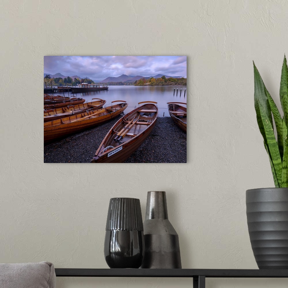 A modern room featuring Rowing boats on the shore of Derwent Water at Keswick in the English Lake District.