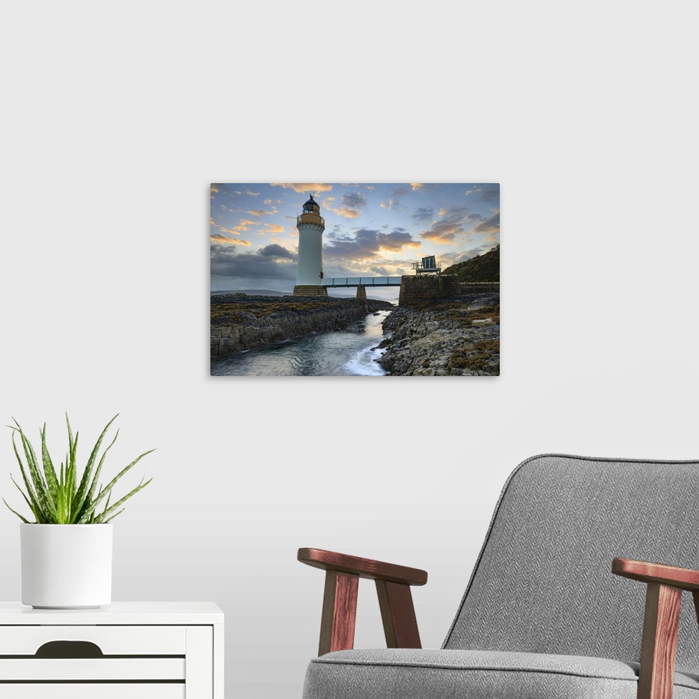 A modern room featuring Rubha nan Gall Lighthouse captured shortly after sunrise.