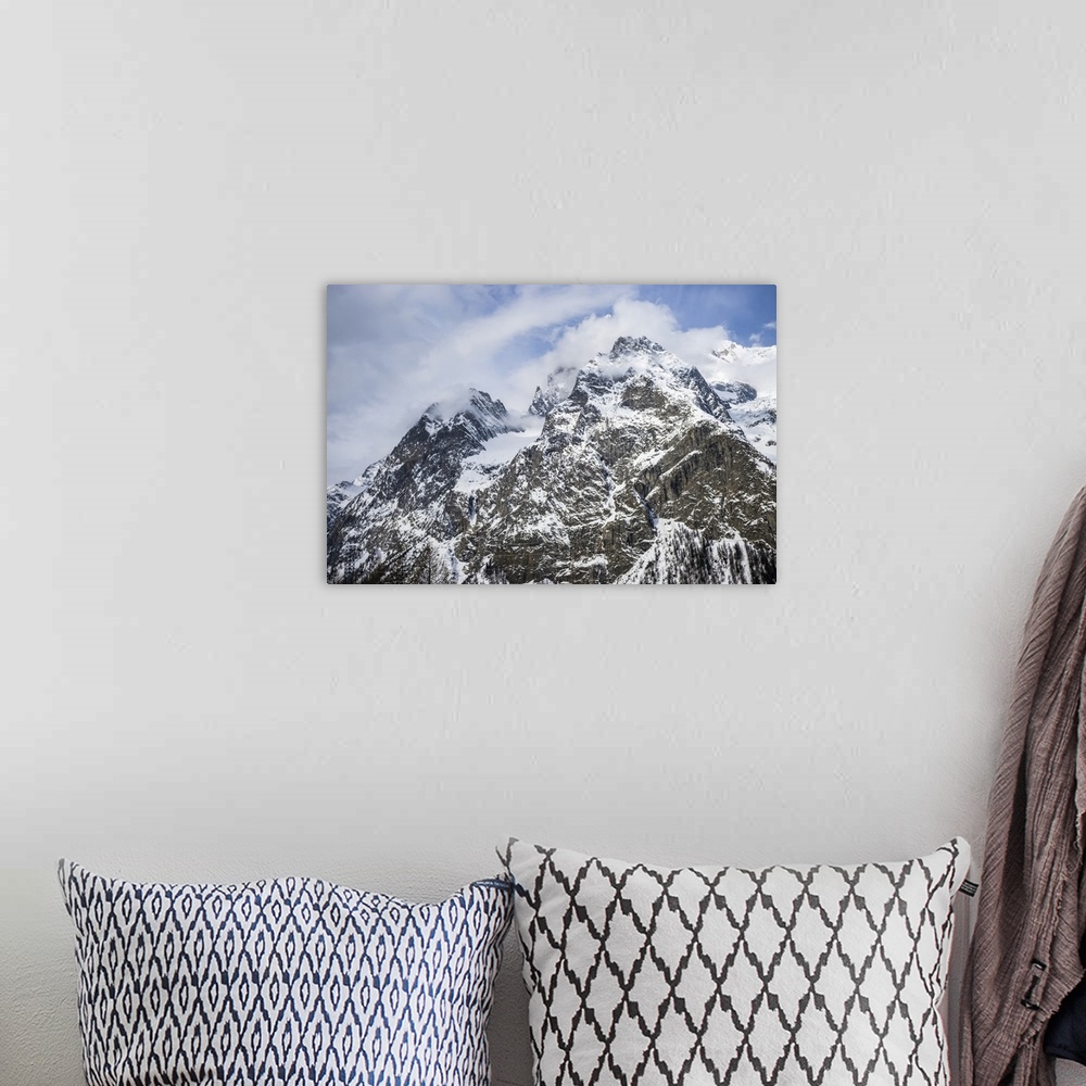 A bohemian room featuring Rugged peaks of snow-covered mountains, Italian side of Mont Blanc; Courmayeur, Valle D'Aosta, It...