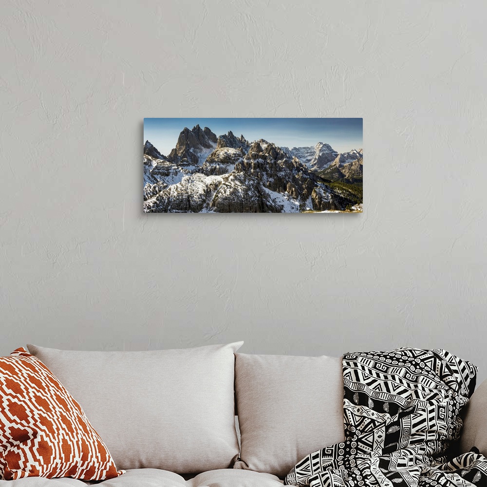 A bohemian room featuring Rugged snow-covered mountain range with blue sky, San Candido, Bolzano, Italy.