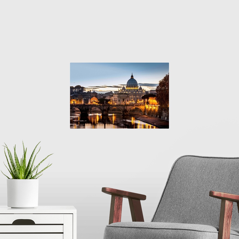 A modern room featuring Saint Peter's Basilica, the world's largest church, at sunset. Vatican City, Italy.