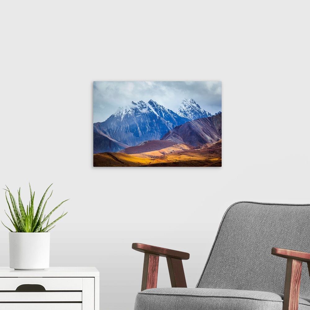 A modern room featuring Layers of hills and mountains line Polychrome Pass along the Kantishna Wilderness Trail in Denali...