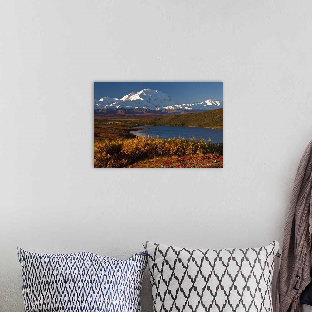 A bohemian room featuring Large photo on canvas of snow covered mountains in the distance and layers of forests by a lake i...