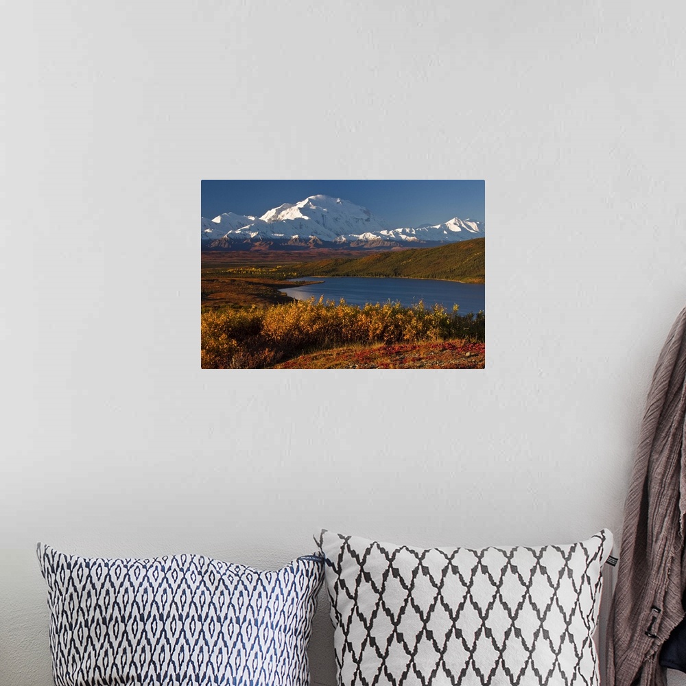 A bohemian room featuring Large photo on canvas of snow covered mountains in the distance and layers of forests by a lake i...