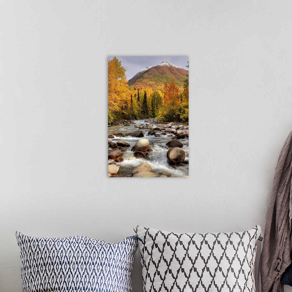 A bohemian room featuring Vertical photograph on a large wall hanging of the rocky Little Susitna River leading toward a la...
