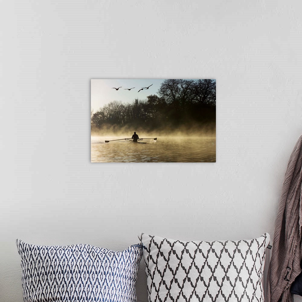 A bohemian room featuring Sculling in mist on River Thames, London, England