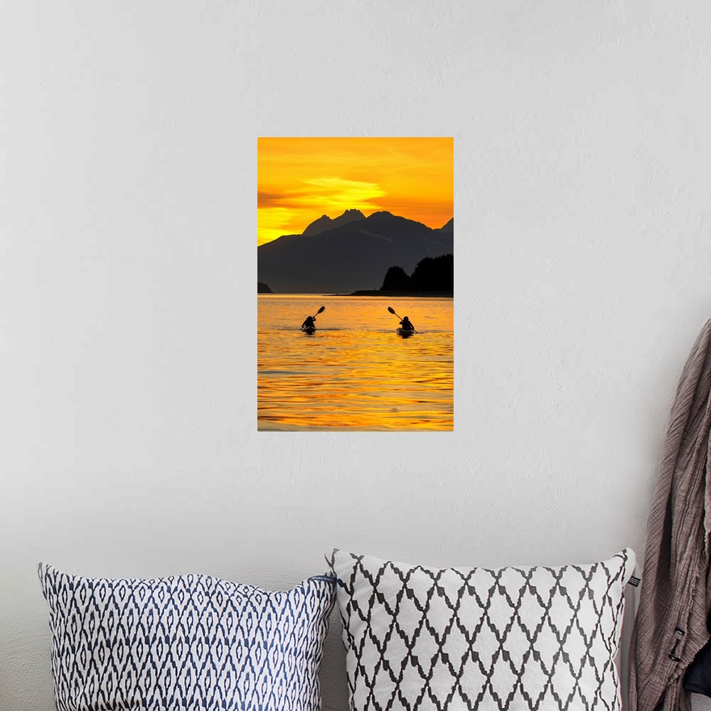 A bohemian room featuring Sea Kayaking on a sublime evening in Lynn Canal near Eagle Beach State Recreation Area, Juneau, A...