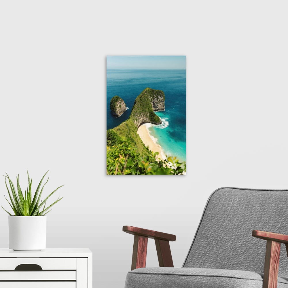 A modern room featuring Sea stack and rock formation along coastline jutting out into the ocean in the Nusa Islands, Klun...