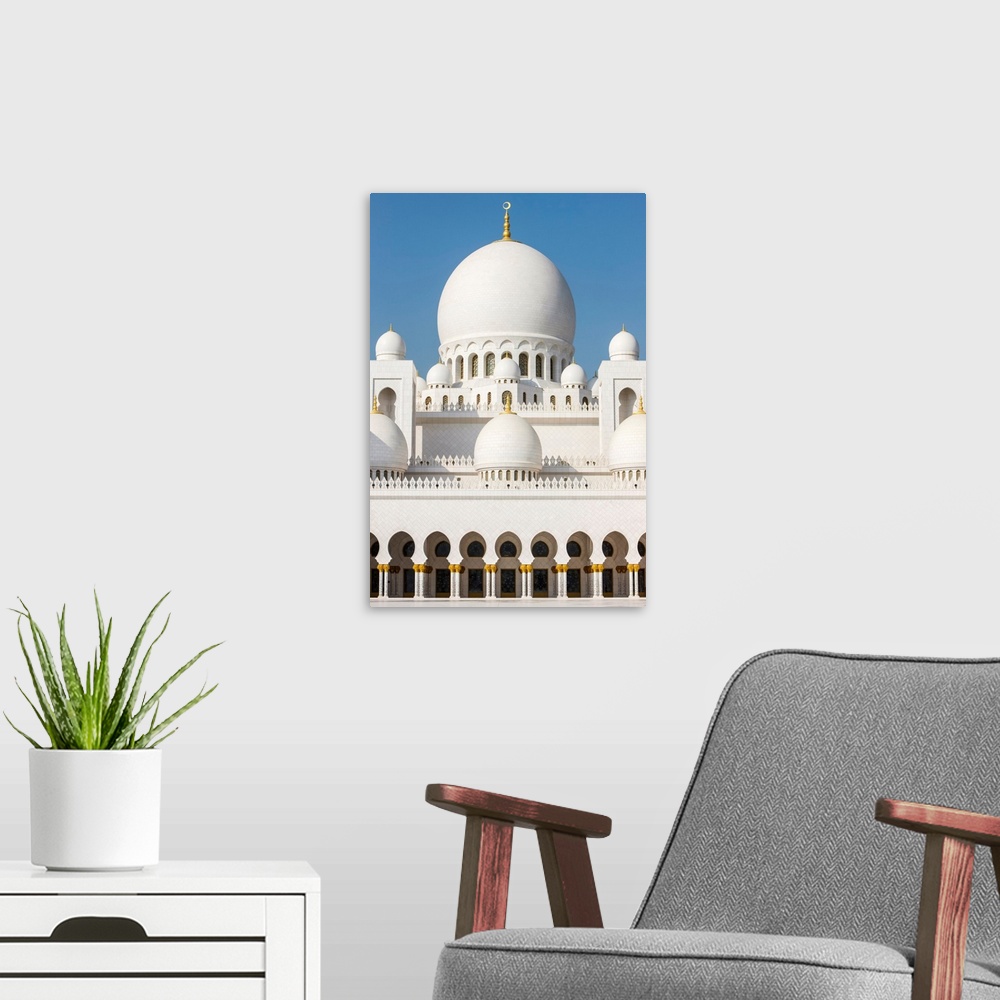A modern room featuring Sheikh Zayed Grand Mosque. The main dome is the biggest mosque dome in the world.