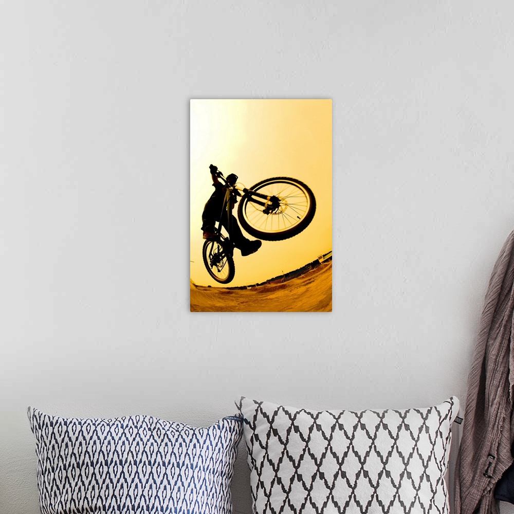 A bohemian room featuring Silhouette Of A Cyclist Against A Yellow Sky
