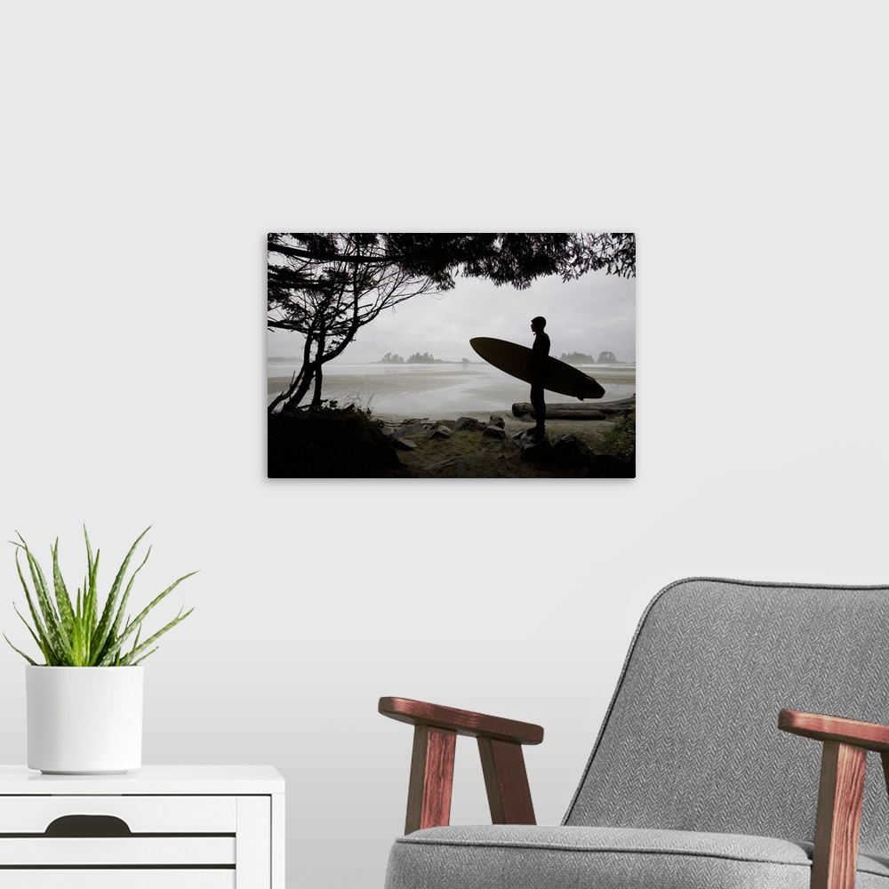 A modern room featuring Silhouette Of A Surfer Looking Out To The Water From The Beach