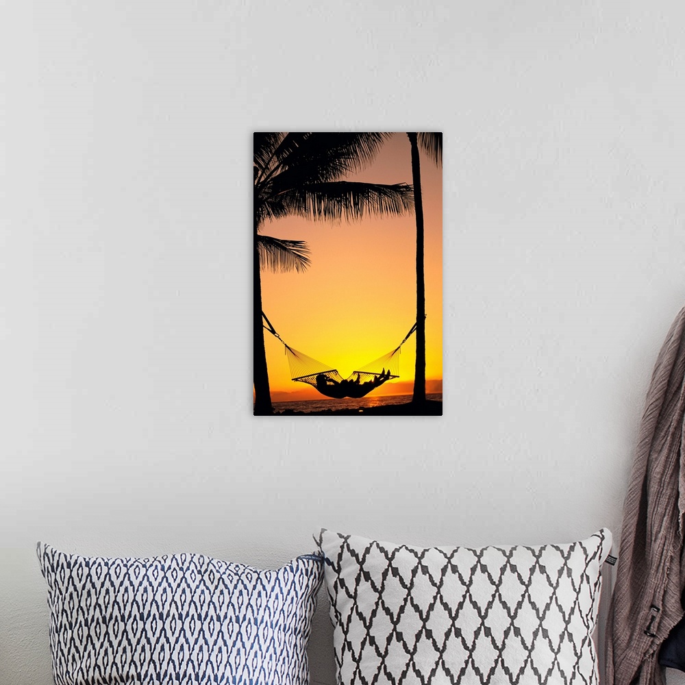 A bohemian room featuring Silhouetted Couple Laying In Hammock On Beach At Sunset