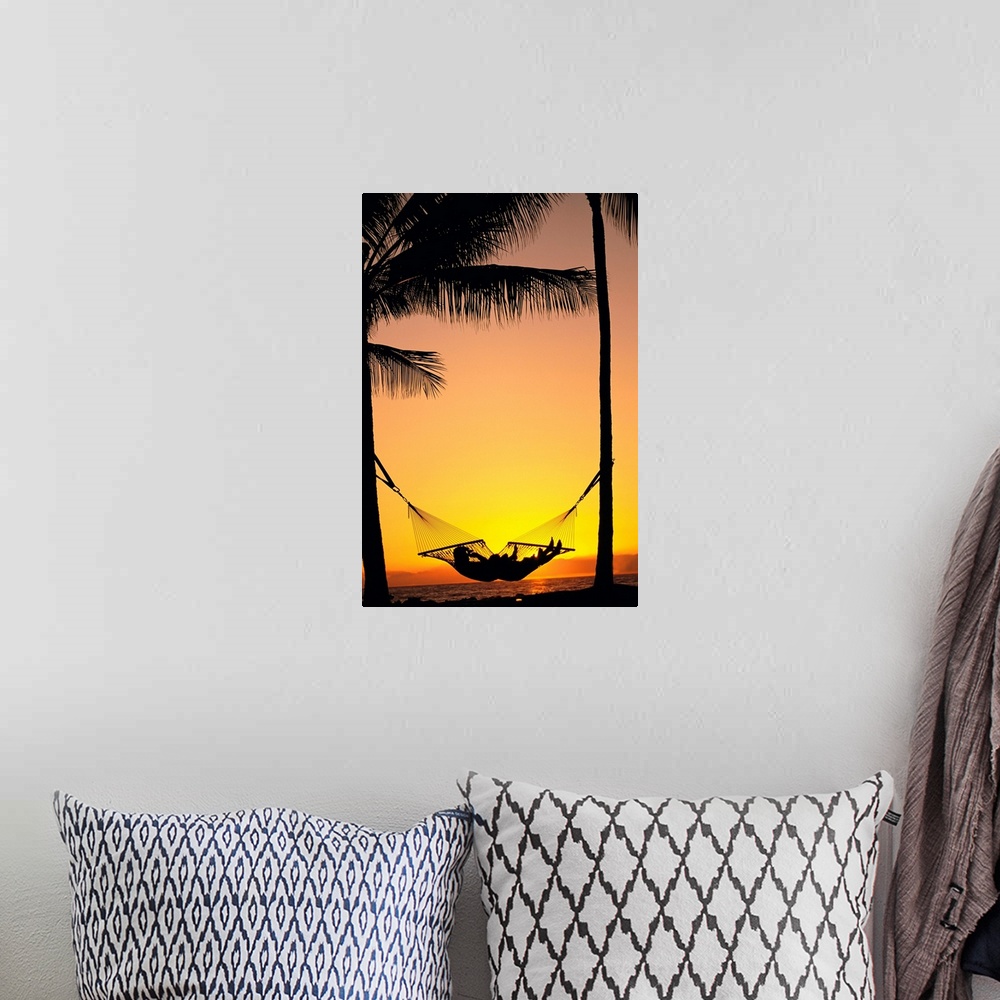 A bohemian room featuring Silhouetted Couple Laying In Hammock On Beach At Sunset