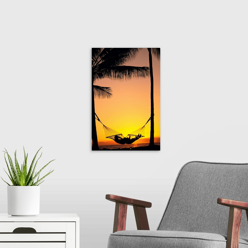A modern room featuring Silhouetted Couple Laying In Hammock On Beach At Sunset