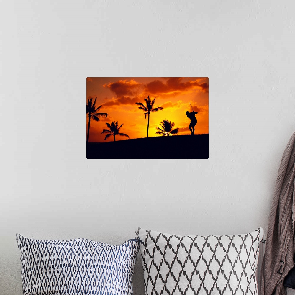 A bohemian room featuring Silhouetted Golfer In Dramatic Orange Sunset Sky