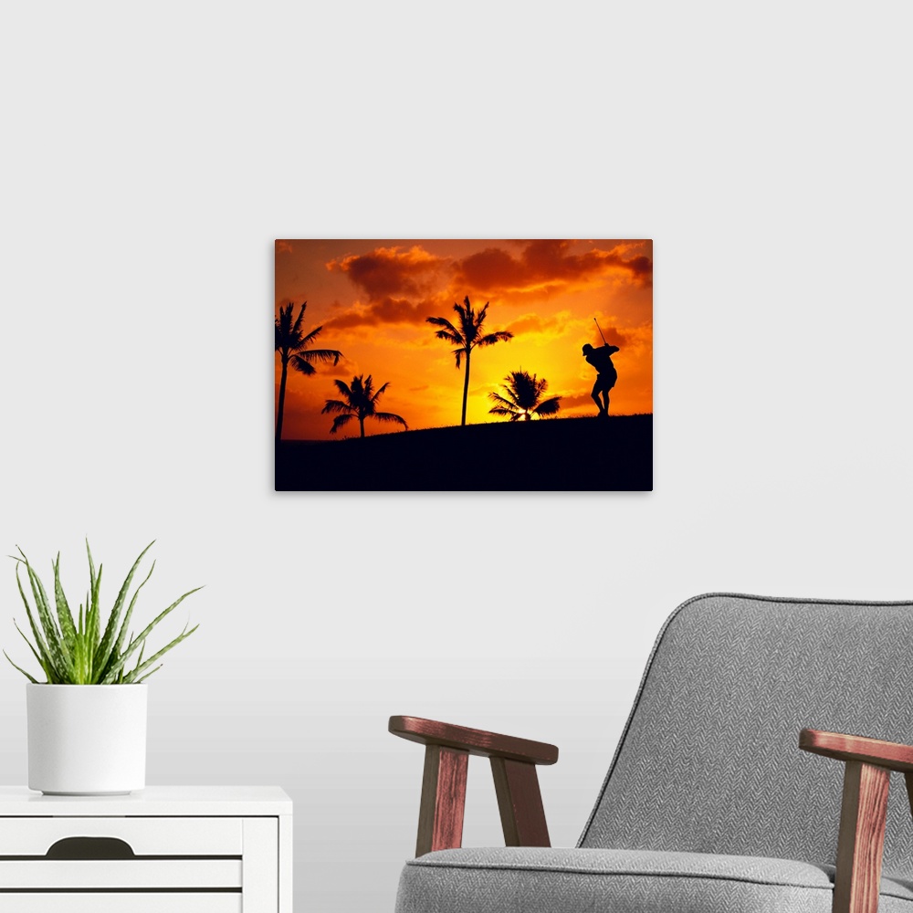 A modern room featuring Silhouetted Golfer In Dramatic Orange Sunset Sky