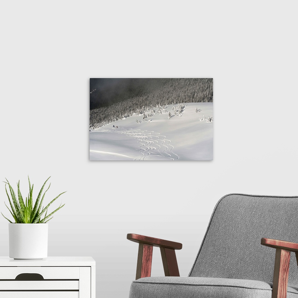 A modern room featuring Skiers At The Base Of A Mountain; Whistler, British Columbia, Canada